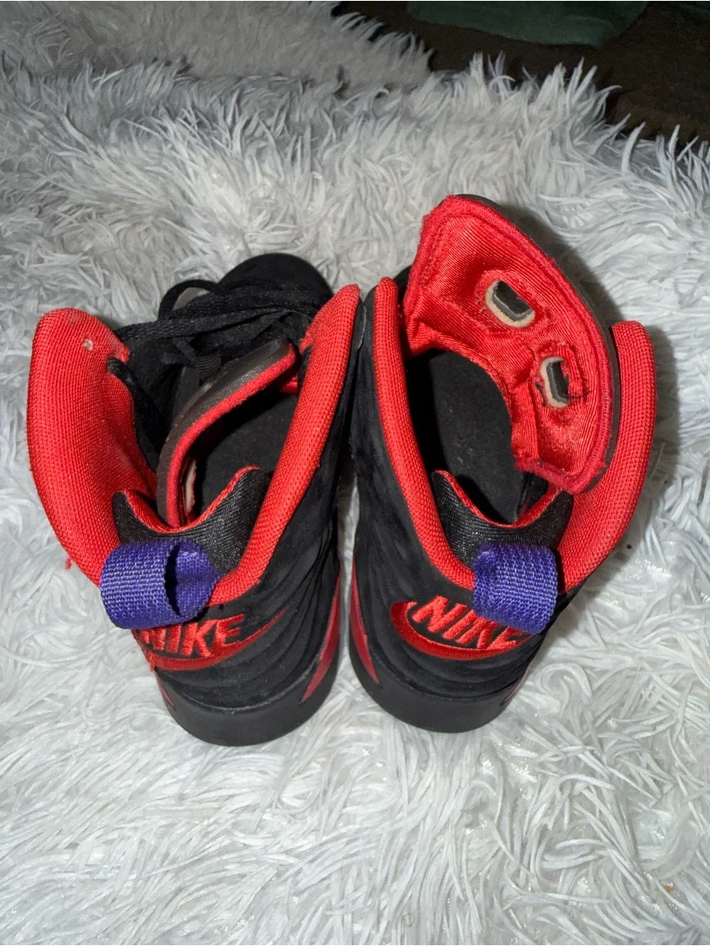 Nike Kids Black Sneakers with Red Lining and Purple Heel Tabs